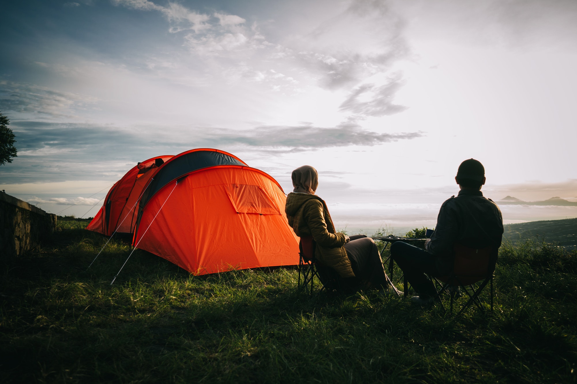 asian-couple-camping-with-sunrise-view-in-mountain.jpg